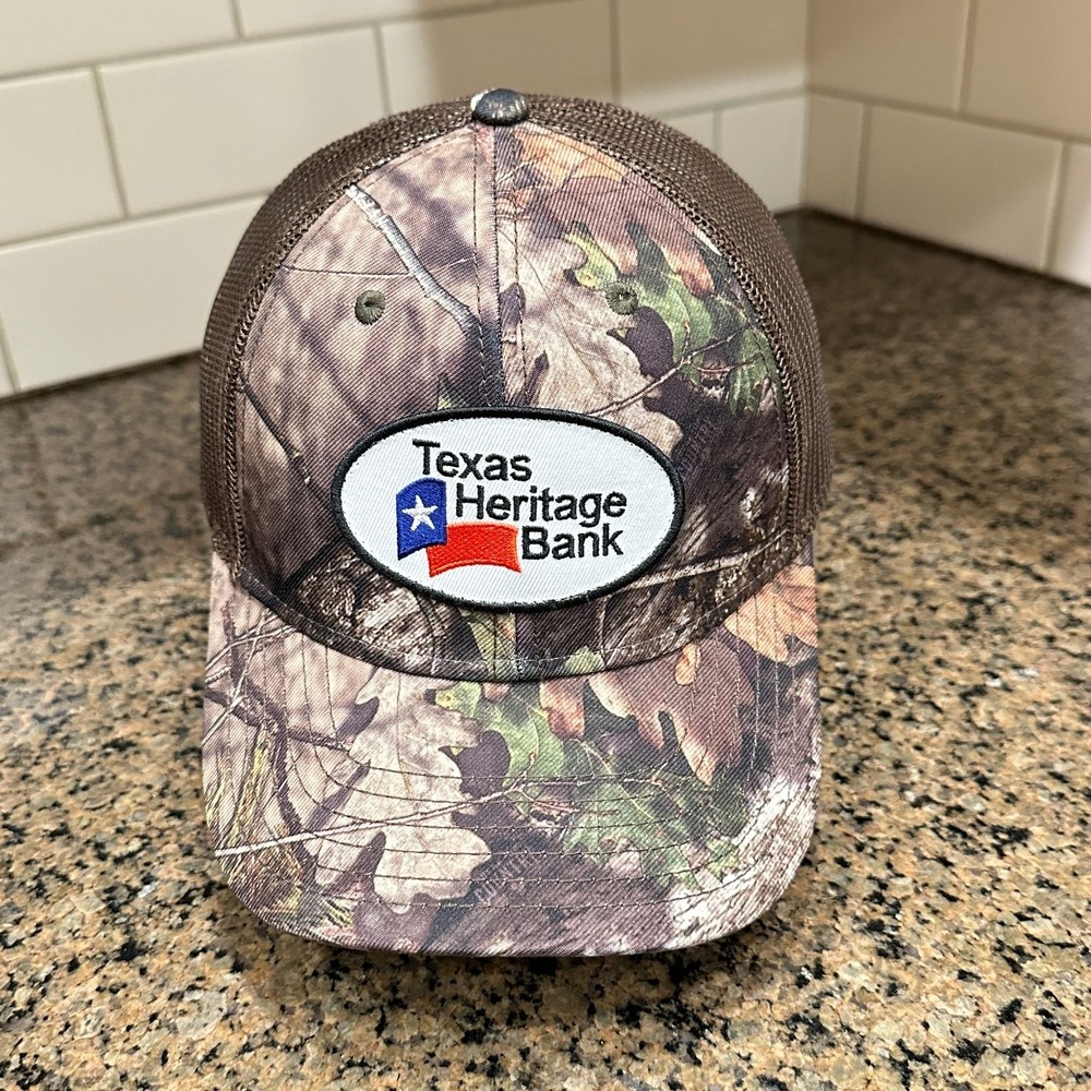 Texas Heritage Bank OTTO Mossy Oak Camo Trucker Hat Snapback